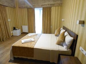 Voodi või voodid majutusasutuse Magic Hotel toas