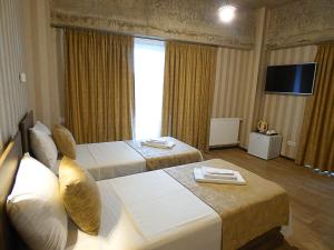 Voodi või voodid majutusasutuse Magic Hotel toas