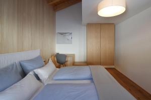 Postel nebo postele na pokoji v ubytování Loft7