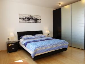 Ένα ή περισσότερα κρεβάτια σε δωμάτιο στο Apartments Jovic Opatija