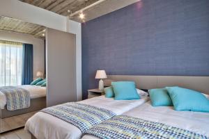 Postel nebo postele na pokoji v ubytování Cozy Rooms Hotel