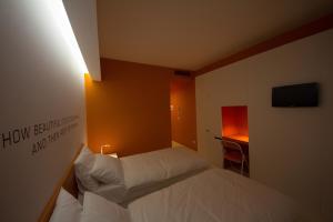 Posteľ alebo postele v izbe v ubytovaní Bed 'n Design