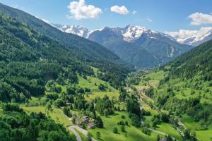an aerial view of a valley with mountains at Residence V in Ponte di Legno