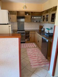 A kitchen or kitchenette at Apartmánový dom Magda