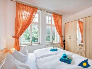 Ein Bett oder Betten in einem Zimmer der Unterkunft Villa Malve Wohnung 05