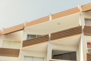 a building with balconies on the side of it at Andriana City Centre Flat in Larnaca