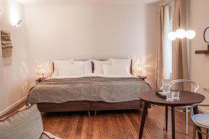 Łóżko lub łóżka w pokoju w obiekcie Boutique Hotel Boškinac