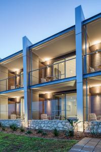 
a building that has a lot of windows in it at Aurora Ozone Hotel Kangaroo Island in Kingscote
