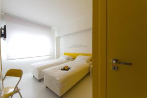 Posteľ alebo postele v izbe v ubytovaní Bed 'n Design