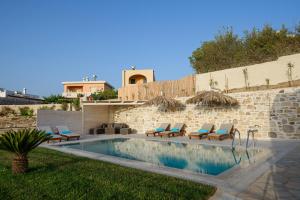 a backyard with a swimming pool and a house at Villa Salla Luxury in Sívas