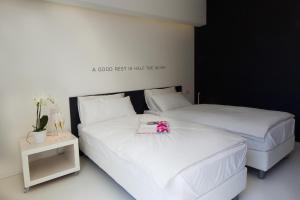 Posteľ alebo postele v izbe v ubytovaní Bed 'n Design
