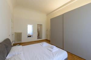 Ein Bett oder Betten in einem Zimmer der Unterkunft Elegance in Santa Maria Novella