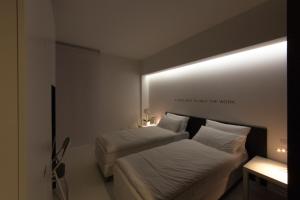 Posteľ alebo postele v izbe v ubytovaní Bed 'n Design