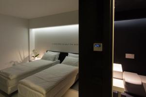 Posteľ alebo postele v izbe v ubytovaní Bed 'n Design