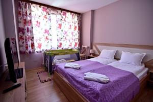 A bed or beds in a room at City Apartments