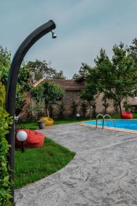 The swimming pool at or close to Guest House Raiski Kаt