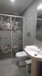 a bathroom with a toilet and a sink at Bayside Salgados in Albufeira