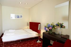 Tempat tidur dalam kamar di Hotel Dona