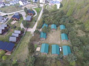 an aerial view of a house with blue roofs at domki pestka in Jastrzębia Góra +3 photos