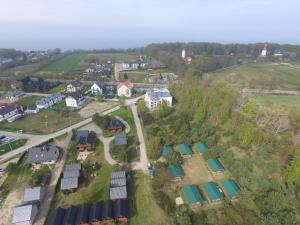 an overhead view of a village with a bunch of green roofs at domki pestka in Jastrzębia Góra