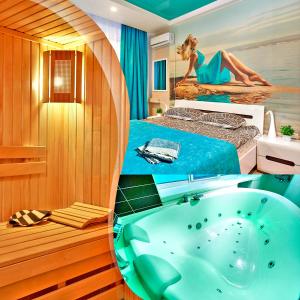 a bathroom with a tub and a bed with a mermaid on it at Big Jacuzzi , Sauna , Khreshchatyk apartments in Kyiv