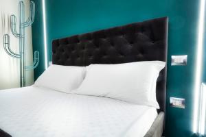 Postel nebo postele na pokoji v ubytování Palazzo Eugenia Suites