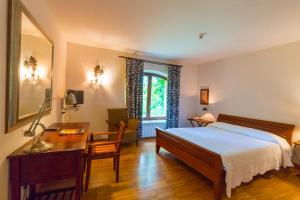 מיטה או מיטות בחדר ב-Hotel El Molino de Salinas