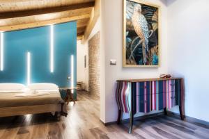 Postel nebo postele na pokoji v ubytování Palazzo Eugenia Suites