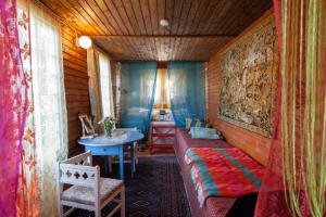 a room with a bed and a table in it at Cirkus Hostel Holken in Inkoo