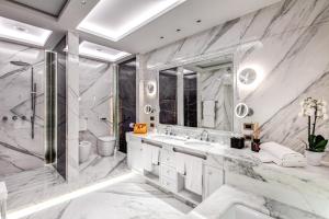 a bathroom with two sinks and a shower at Hotel Splendide Royal - The Leading Hotels of the World in Rome