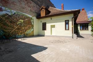 a building with a mural on the side of it at 1790 Margarethengasse Guesthouse in Sibiu