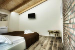 Postel nebo postele na pokoji v ubytování Palazzo Eugenia Suites