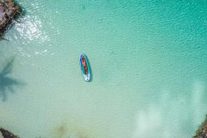 an aerial view of a boat in the water at Sal Si Puedes in Tintipan Island