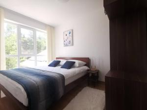 Voodi või voodid majutusasutuse Gonik Apartmani toas