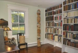 a room with two large book shelves filled with books at Walnut Run Farm in Woodville