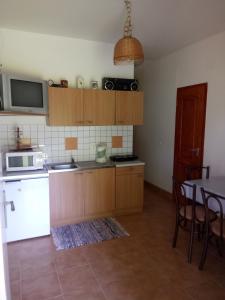 Kuchyň nebo kuchyňský kout v ubytování Apartmány Denis + 6 fotografií