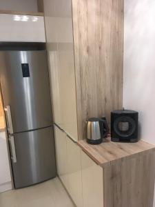 Kuchyňa alebo kuchynka v ubytovaní SUN-DIAL APARTMAN