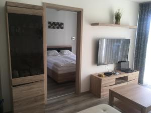 Posteľ alebo postele v izbe v ubytovaní SUN-DIAL APARTMAN