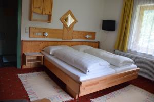 Łóżko lub łóżka w pokoju w obiekcie Pension Appartement Ambrosi