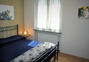 Postel nebo postele na pokoji v ubytování Liguria Village + 37 fotografií