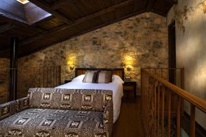 En eller flere senger på et rom på Hotel Rural & Spa Los Ánades