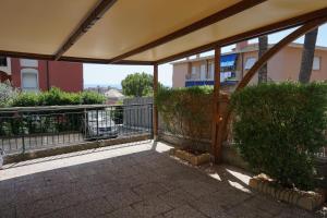 a patio with awning on a building at Appartamento Villa Cristina in Genoa