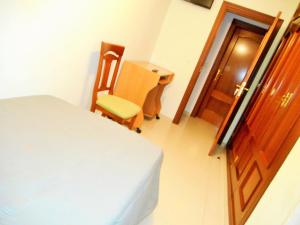Ein Bett oder Betten in einem Zimmer der Unterkunft Martin House & Granada