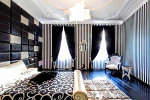 a living room with black and white striped walls at Luxury Penthouse Apartment in Budapest