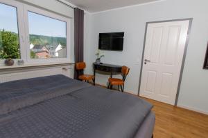 Postel nebo postele na pokoji v ubytování Weingut Gerd Müllers