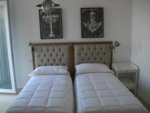 A bed or beds in a room at B&B Villa Cinzia
