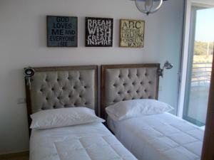 A bed or beds in a room at B&B Villa Cinzia