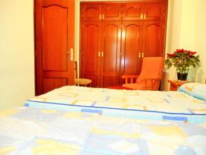 Ein Bett oder Betten in einem Zimmer der Unterkunft Martin House & Granada