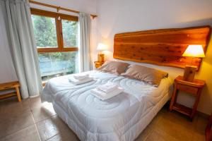 Postel nebo postele na pokoji v ubytování Cabañas Villa Sequoia
