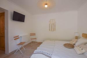 Postel nebo postele na pokoji v ubytování Le Clos en Provence